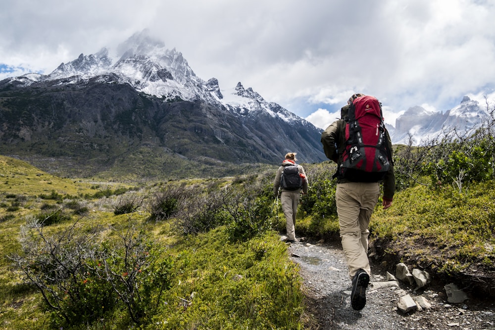 Hikers walking along a scenic mountain trail