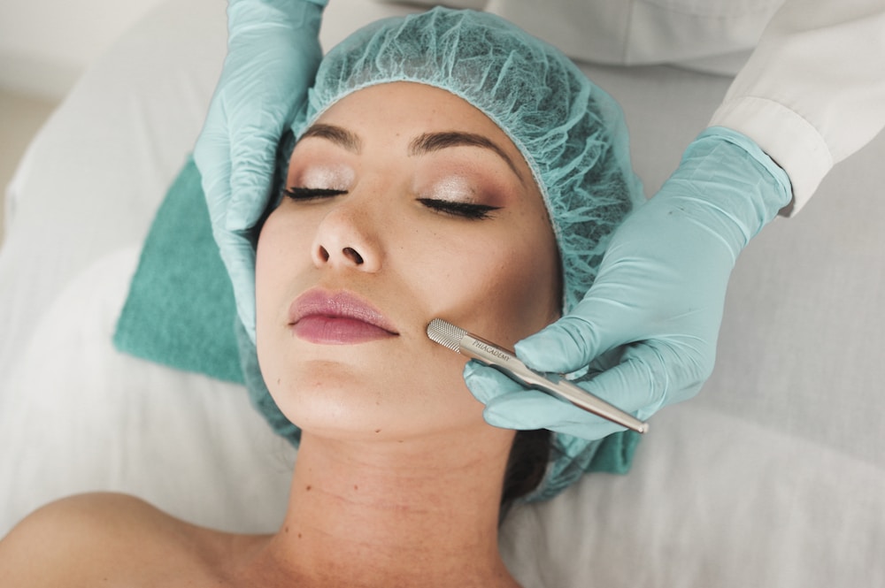 Skincare professional giving a facial treatment